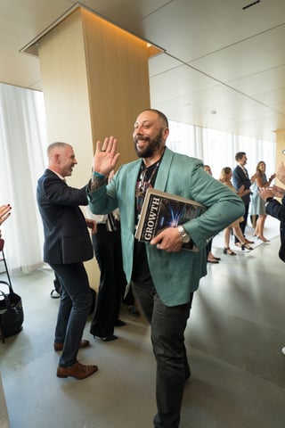 impact summit image - attendee high-five